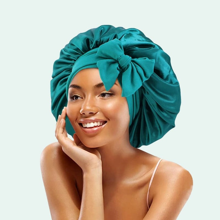 Bonnet de nuit brillant extensible en satin bleu pétrole