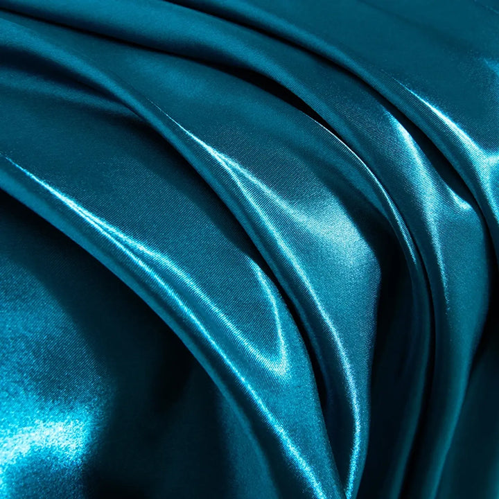 Drap-housse en satin brillant et taies d'oreillers bleu pétrole l Satin Lifestyle
