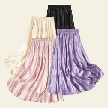 Différents modèles de jupes plissées trapèzes mi-mollet en soie véritable 