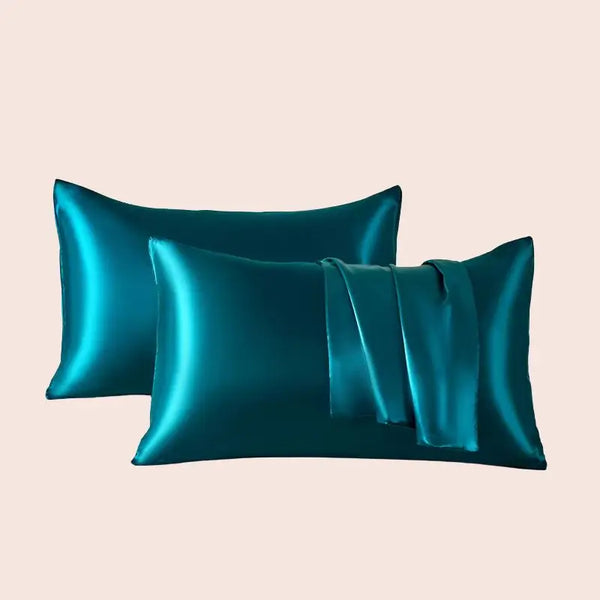 Paire de taies d'oreiller en satin couleur bleu pétrole