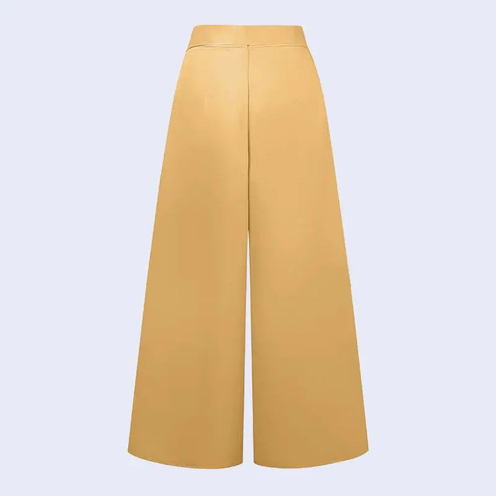 Arrière d'un pantalon large plissé avec fermeture zip en satin couleur jaune