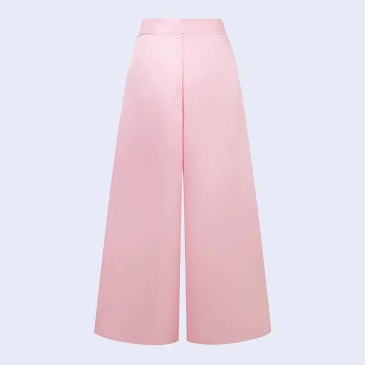 Arrière d'un pantalon large plissé avec fermeture zip en satin couleur rose