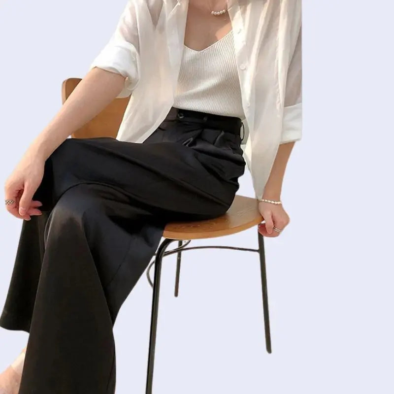 Pantalon long brillant boutonné en satin noir