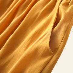 Tissu ocre du pantalon long élastique à jambes larges en soie véritable
