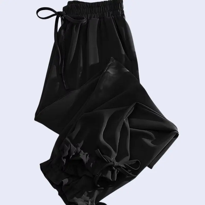 Sarouel plissé poches et nœuds en satin noir